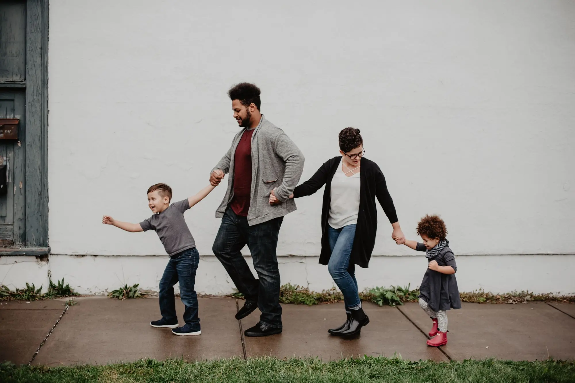 A family of four walking together